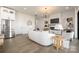 Bright, open living space featuring stainless steel appliances, a modern fireplace, and stylish decor at 17201 Green Hill Rd, Charlotte, NC 28278