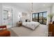 Serene main bedroom featuring a king bed, private balcony access, and ensuite bathroom at 17201 Green Hill Rd, Charlotte, NC 28278