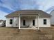 Well-maintained backyard with a covered patio and a grassy lawn at 228 Heatherland Dr, Rock Hill, SC 29732