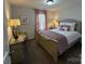 This bedroom features a comfortable bed, neutral walls, and natural light through the curtains at 228 Heatherland Dr, Rock Hill, SC 29732