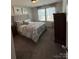 Comfortable bedroom with large bed, neutral tones, and ample natural light at 228 Heatherland Dr, Rock Hill, SC 29732