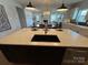 Open-concept kitchen with large island, breakfast bar, and stainless steel appliances at 228 Heatherland Dr, Rock Hill, SC 29732
