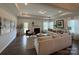 Spacious living room featuring a fireplace, tray ceilings, recessed lighting, and hardwood floors at 228 Heatherland Dr, Rock Hill, SC 29732