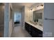 Bathroom with double sink vanity, large mirror, tile floors and stone shower at 228 Heatherland Dr, Rock Hill, SC 29732