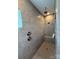 Walk-in shower with neutral tile, dual shower heads, and built-in bench at 228 Heatherland Dr, Rock Hill, SC 29732
