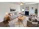 Bright living room featuring a cozy fireplace, plush seating, and stylish decor, ideal for relaxation at 246 Tail Race Ln, Fort Mill, SC 29715