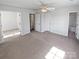 Large main bedroom with neutral carpet, multiple closets, and access to the bathroom at 246 Tail Race Ln, Fort Mill, SC 29715
