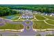 Community aerial featuring a clubhouse, tennis courts and beautifully maintained greenery and walking paths at 2617 Manor Stone Way, Indian Trail, NC 28079
