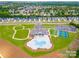 Community aerial showcasing an amazing clubhouse with pool, tennis courts, lush landscaping and neighborhood homes at 2617 Manor Stone Way, Indian Trail, NC 28079