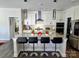 Gourmet kitchen with stainless steel appliances, granite countertops, and a large center island with seating at 2617 Manor Stone Way, Indian Trail, NC 28079