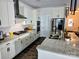 Modern kitchen featuring stainless steel appliances, granite counters, and ample cabinet space at 2617 Manor Stone Way, Indian Trail, NC 28079