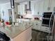 Well-appointed kitchen with stainless steel appliances, granite countertops, and a spacious island at 2617 Manor Stone Way, Indian Trail, NC 28079