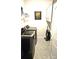 Laundry room with appliances, storage cabinets, and gray tile flooring at 2617 Manor Stone Way, Indian Trail, NC 28079