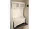 Mudroom showing an organization station with storage cabinets, hooks, and seating at 2617 Manor Stone Way, Indian Trail, NC 28079