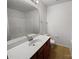 Bathroom featuring a single sink vanity with wood cabinets and a large mirror at 2643 Meadow Knoll Dr, Charlotte, NC 28269
