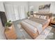 Cozy staged bedroom with soft lighting, neutral tones, and a comfortable bed for a relaxing atmosphere at 2643 Meadow Knoll Dr, Charlotte, NC 28269