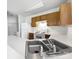 Kitchen showcasing stainless steel sink, white countertops, and wood cabinets at 2643 Meadow Knoll Dr, Charlotte, NC 28269