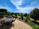 Wonderful backyard stone patio including a built-in fire pit and outdoor dining at 305 Hemlock Bluff Ct, Denver, NC 28037