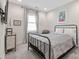 Comfortable bedroom with a cozy seating area, side table and modern lighting at 305 Hemlock Bluff Ct, Denver, NC 28037