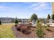 A backyard patio area with a fire pit and patio furniture at 305 Hemlock Bluff Ct, Denver, NC 28037
