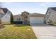 Charming home with a two-car garage, well-maintained lawn, and stone accents at 305 Hemlock Bluff Ct, Denver, NC 28037