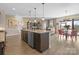 Spacious kitchen with granite countertops, stainless steel appliances, and an open layout connected to the dining area at 305 Hemlock Bluff Ct, Denver, NC 28037