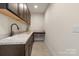The laundry room has dark wood cabinets and countertops at 305 Hemlock Bluff Ct, Denver, NC 28037