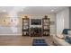 Comfortable living room with wooden shelving, stylish decor, and modern furniture at 305 Hemlock Bluff Ct, Denver, NC 28037