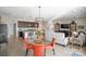 Bright, open-concept living space featuring a modern kitchen, dining area, and comfortable seating at 305 Hemlock Bluff Ct, Denver, NC 28037