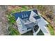 Aerial view of a beautiful luxury home surrounded by a well-manicured lawn and mature trees at 324 Patternote Rd, Mooresville, NC 28117