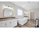 Spacious bathroom featuring a modern tub, double vanities, sleek fixtures, and recessed lighting at 324 Patternote Rd, Mooresville, NC 28117