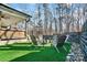 Backyard fire pit area with Adirondack chairs and privacy fence at 324 Patternote Rd, Mooresville, NC 28117