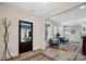 Bright foyer showcases modern decor, stylish furniture, and a view into the main living area at 324 Patternote Rd, Mooresville, NC 28117