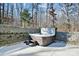 Backyard hot tub with privacy wall and natural surroundings at 324 Patternote Rd, Mooresville, NC 28117