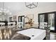 Kitchen island with a modern faucet and a view into dining and living spaces at 324 Patternote Rd, Mooresville, NC 28117