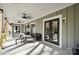 Spacious covered patio with ceiling fans, perfect for outdoor dining at 324 Patternote Rd, Mooresville, NC 28117
