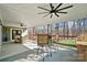 Covered patio with dining table, grill, and backyard views at 324 Patternote Rd, Mooresville, NC 28117