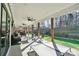 Covered patio with multiple seating areas and ceiling fans at 324 Patternote Rd, Mooresville, NC 28117