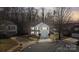 Aerial view of a two-story home featuring a landscaped yard, driveway, and cul-de-sac street at 3247 Bamburgh Ct, Charlotte, NC 28216
