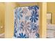 Bright bathroom with floral shower curtain and yellow walls at 3247 Bamburgh Ct, Charlotte, NC 28216