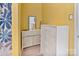 Bright bathroom closet with white dresser and large mirror at 3247 Bamburgh Ct, Charlotte, NC 28216