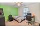 Well lit bedroom with a neutral carpet, desk and black rolling chair at 3247 Bamburgh Ct, Charlotte, NC 28216