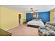 Spacious bedroom with a ceiling fan, exercise bike, and comfortable sitting area at 3247 Bamburgh Ct, Charlotte, NC 28216