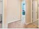 Cozy bedroom with carpeted flooring and a view into another room through an open doorway at 3247 Bamburgh Ct, Charlotte, NC 28216