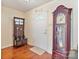 Cozy entryway featuring hardwood floors, a coat rack, and a grandfather clock at 3247 Bamburgh Ct, Charlotte, NC 28216