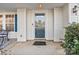 A welcoming front porch featuring a welcome mat, lush shrubs, and a stylish door at 3247 Bamburgh Ct, Charlotte, NC 28216