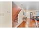 Inviting entry hallway with hardwood floors and staircase leading to upper level at 3247 Bamburgh Ct, Charlotte, NC 28216