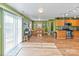 Open concept dining and kitchen area with stainless steel appliances and wooden cabinets at 3247 Bamburgh Ct, Charlotte, NC 28216