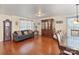 Spacious living room with hardwood floors, a grandfather clock, and an elegant hutch at 3247 Bamburgh Ct, Charlotte, NC 28216