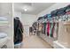 Spacious walk-in closet features built-in shelving and plenty of hanging space for organized storage at 3247 Bamburgh Ct, Charlotte, NC 28216
